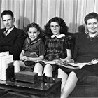 Jack, Carol Ann, Pegge, and Lorene Harrison at their home at 913 6th Avenue, Anchorage, 1942. 