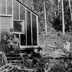 The family's cabin at Jonesville Mine Camp, Alaska, 1921. The individuals shown in the photograph are not identified.