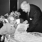 Orah Dee Clark receiving the Cook Inlet Historical Society “Scroll of Honor” on her eighty-seventh birthday in 1962 from Society president Robert B. Clifton.  The Scroll commemorated her distinguished service to Alaska and to Anchorage. 