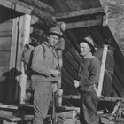 Colonel Frederick Mears (left) and fellow Alaskan Engineering Commission Commissioner Thomas W. Riggs, Jr. prepare to go hunting along the Alaska Railroad.  Mears enjoyed hunting and fishing. Riggs served as territorial governor of Alaska from 1918-1921).     