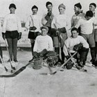 Anchorage hockey team, probably at the Fairbanks Winter Carnival in 1935.  Thomas "Tom" Culhane and Vern Johnson, one of the founders of the Anchorage Fur Rendezvous, are standing at the right end of the group.  Culhane may have learned the game while growing up in Canada. 