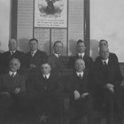 1924 Officers of the Elks Club, which with the Masons, Shriners, Moose, and Pioneers, were important fraternal organizations in Anchorage.  Social events sponsored by these organizations were major events for a community that had to provide much of its own entertainment.  Thomas Price was active in several of these groups, and stands in the back row, fourth from the left, with his hands on the back of the bench in front of him.
