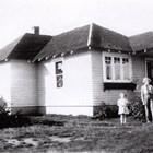 Mary Jane McGettigan, left, and Betty Aho at the Anchorage family home at Sixth Avenue and K Street.