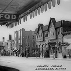 Looking across 4th Avenue to the Bevers and Pfeil Building, one of the larger commercial structures in Anchorage, which housed several businesses, including the Cheechako Tavern. John Balios ran a cafe in the back of the tavern.