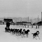 Dog driver Oscar Nord with members of the Barnett family, 1926.