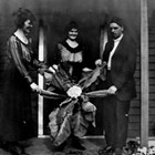 Frank Berry and friends with cauliflower, 737 E Street, Anchorage, 1921.