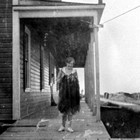 Ruth Carlson in front of the Inlet Hotel, Anchorage, 1921.