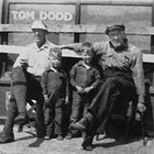 Edward "Ed" Dodd, sons Robert "Bobby" and George, and Ed's uncle Tom Dodd at Tom's general store in Kanatak, Alaska in 1931.