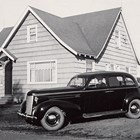 Edward "Ed" Dodd in a new car at home, 705 H Street, Anchorage.