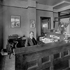 Winfield Ervin Sr. in the front office of the First National Bank of Anchorage, ca. 1930.