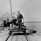Emil Harlacher with daughter Betty at the General Fish Dock, Anchorage, 1931.