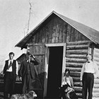 Victor Johnson, Elin Johnson, son Donald Johnson and friends at the completed home, Anchorage, 1918.