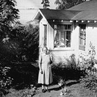 Elizabeth Landstrom in front of home, 3rd Avenue and H Street, Anchorage.
