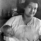 Mattie Leckvold with son, Harry, at their first home, Cottage No. 13, Government Hill, Anchorage, in 1923.
