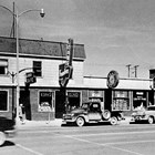 Buildings at 4th Avenue and B Street, Anchorage, shown in 1950.   This was the original site of the Lido Hotel, which burned down during World War II and was rebuilt.