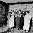 The Quinton and Knapp families with Nell Hewitt, at the Knapp home, 8th Avenue and L Street, Anchorage, 1923.
