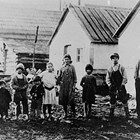 The Iannone (or Reno) family in front of their store and roadhouse, Girdwood, 1918.