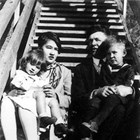 Renee and Harry Seller with younger children Betty and John on the steps of their home in Anchorage at the end of Fourth Avenue, 1927.