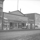 A view of Daniel O'Connell Kennedy Jr.'s post-1934 clothing store, located on the south side of Fourth Avenue, several doors west of the hardware store owned by his brother George.
