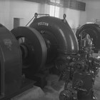 The interior of the original Eklutna hydroelectric plant showing the turbines. The City of Anchorage and the Alaska Railroad both drew power from this plant.