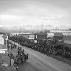 Vaara’s Varieties is shown on the right side of this photograph during a Fur Rendezvous sled dog race, possibly from the 1940s.