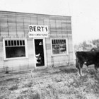 Bert’s Drug Store branch store in Palmer, Alaska, which was built by brothers Bert and "L.J." "Osky" Weeda in 1935, anticipating an increase in business because of the arrival of the Matanuska Colonists. The picture was taken by Henrietta ("Hank") Marsden, who noted in the photograph album “that wasn’t Osky” in front.