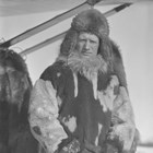 Oscar Winchell wearing a reindeer fur Eskimo parka for winter flying.  