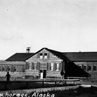 The large log cabin building of the United Service Organization (USO) at the corner of 5th Avenue and G Street, Anchorage.  The USO provided a wholesome recreational place for military personnel.  Lucy Cuddy volunteered here during World War II.