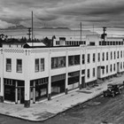 First National Bank offices on the Southeast corner of Fourth and G Streets, Anchorage, ca. 1938-1939.  This photograph was taken during the period when Warren Cuddy purchased controling interest in the bank. 