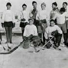 Anchorage hockey team, probably at the Fairbanks Winter Carnival in 1935. Thomas "Tom" Culhane and Vern Johnson, one of the founders of the Anchorage Fur Rendezvous, are standing at the right end of the group. Culhane may have learned the game while growing up in Canada.