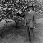 James Delaney standing next to one of his prized crabapple trees that grew on his house lot in downtown Anchorage.