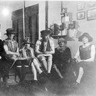 A view of some of the Anchorage city fathers in drag.  The photograph has been titled “Going Calling,” and it was taken in the Anchorage Fire Station on April 6, 1926.  James Delaney is third from the left.  The other men in the photograph are (left to right):  Vic Anderson, Emil Pfeil, Delaney, Ray Matheson, George C. Dickson, and Fred Carlquist.