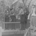 Anchorage mayor James Delaney (second man on the left) at the Anchorage Light and Power Company’s Eklutna River Gorge hydroelectric dam around 1930, just after Anchorage began getting its power through this company.  The third figure from the left is Oscar Gill, who was a city councilman during the three years that Delaney was mayor, and succeeded Delaney in the mayor’s office in 1932.  