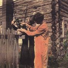 The Hamill’s first house in Anchorage, around 1920, a log structure.
