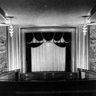 The 4th Avenue Theatre (630 West 4th Avenue), the largest of the chain of theaters Austin E. "Cap" Lathrop built in Alaska, was begun in 1941, but construction was halted because of World War II; the building was completed in 1947. Besides its size, the theater was known for its elaborate murals that flanked the stage and screen, representing Alaska life and industry. He preferred to use the British spelling of "theatre" in officially naming these venues.