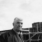 Austin E. "Cap" Lathrop outside a construction project.  He was known for being sometimes irascible, but also for being fair and generous with his employees, who were very loyal to him. 