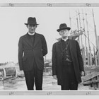 Father O’Flanagan on the left standing beside Bishop Joseph R. Crimont, S.J., Vicar Apostolic of Alaska,  viewing the construction of the original Providence Hospital in Anchorage in the late 1930s.
