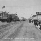 A view of Anchorage’s Fourth Avenue, looking the other way during the 1918 Fourth of July Parade, with Arthur A. Shonbeck’s store on the left.