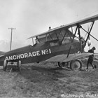 The Travel Air 7000, one of two airplanes owned by Anchorage Air Transport, Inc., when they began business in 1927.  Russel Hyde Merrill was the company’s chief pilot.   Although the pilot flew in an open cockpit, passengers or freight were carried in an enclosed cabin just behind the engine.