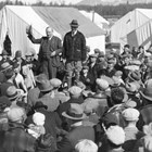 Otto Ohlson addressing the Matanuska colonists in 1936.  Years before the Matanuska Colony had been organized, he had written a pamphlet encouraging homesteaders to come to Alaska and develop local agriculture.  Ohlson was a major supporter of the Matanuska Colony.  