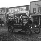 Joseph "Joe" Spenard had one of the first gasoline powered vehicles in Anchorage which he used in his hauling or "transfer" business, City Express. He enjoyed being around children, and photographs often show him driving in a parade, his vehicle crammed to overflowing with children.
